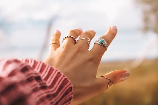 Hands styled with delicate Guhas Gems and Jewelleries rings